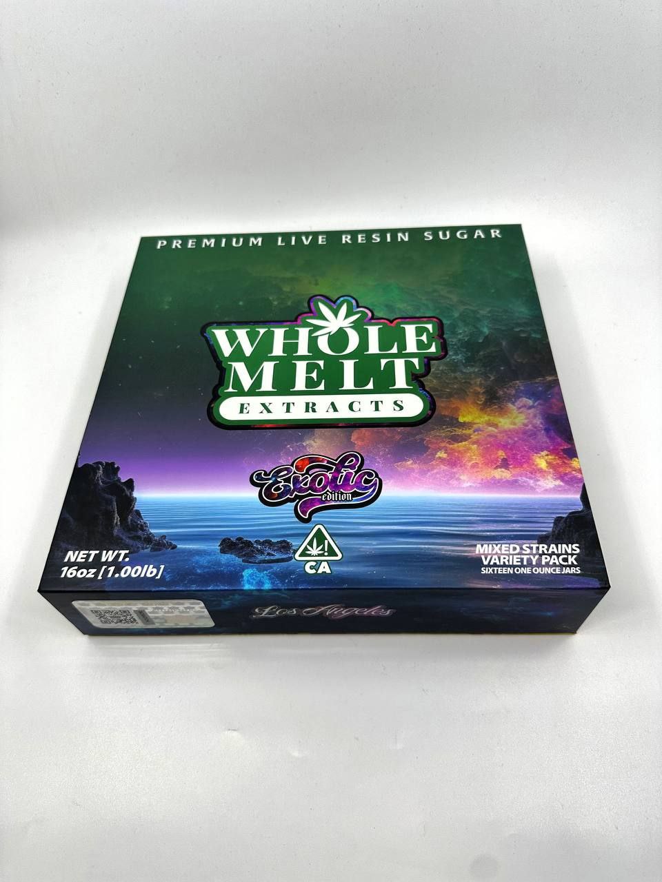Image of a box for "Import placeholder for 70," featuring live resin sugar. The colorful design on the box includes text and graphics against a vibrant background showcasing a scenic night sky and ocean. The box indicates a net weight of 16 oz and a mix of strains in the variety pack.