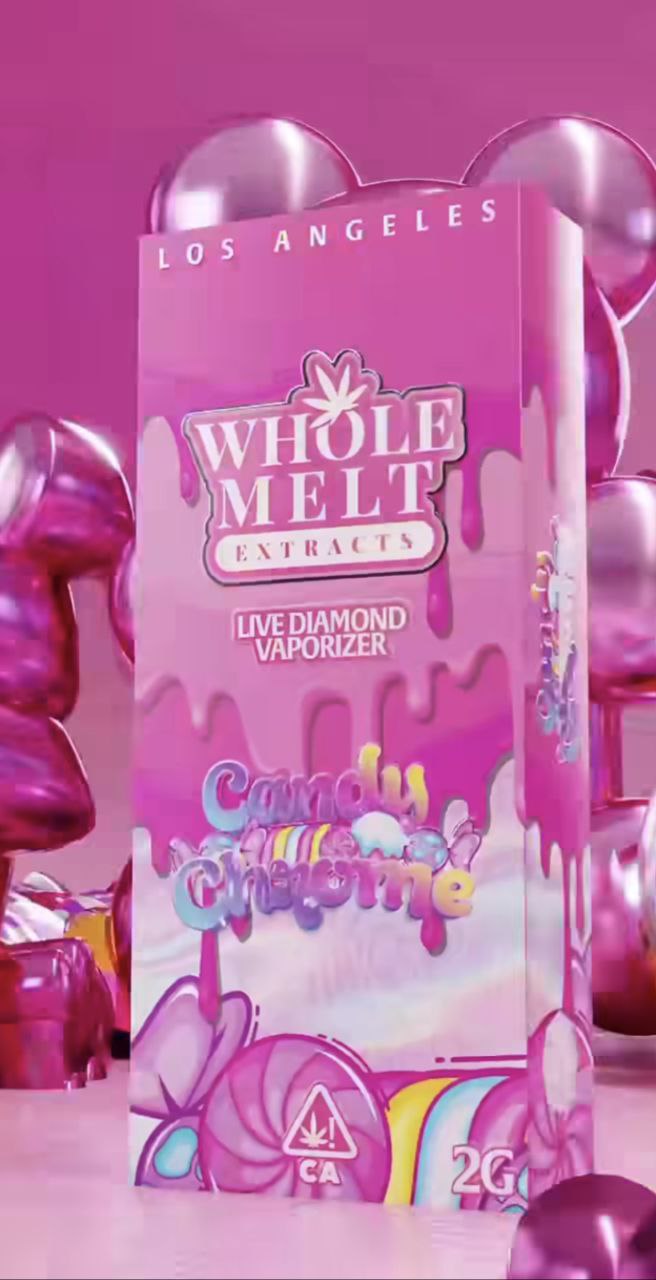 Pink packaging for "Import placeholder for 43" Live Diamond Vaporizer, 2 grams, with "Candy Crasher" written on it. The design features candy and colorful abstract art. The background has metallic, pink, balloon-like shapes and "Los Angeles.