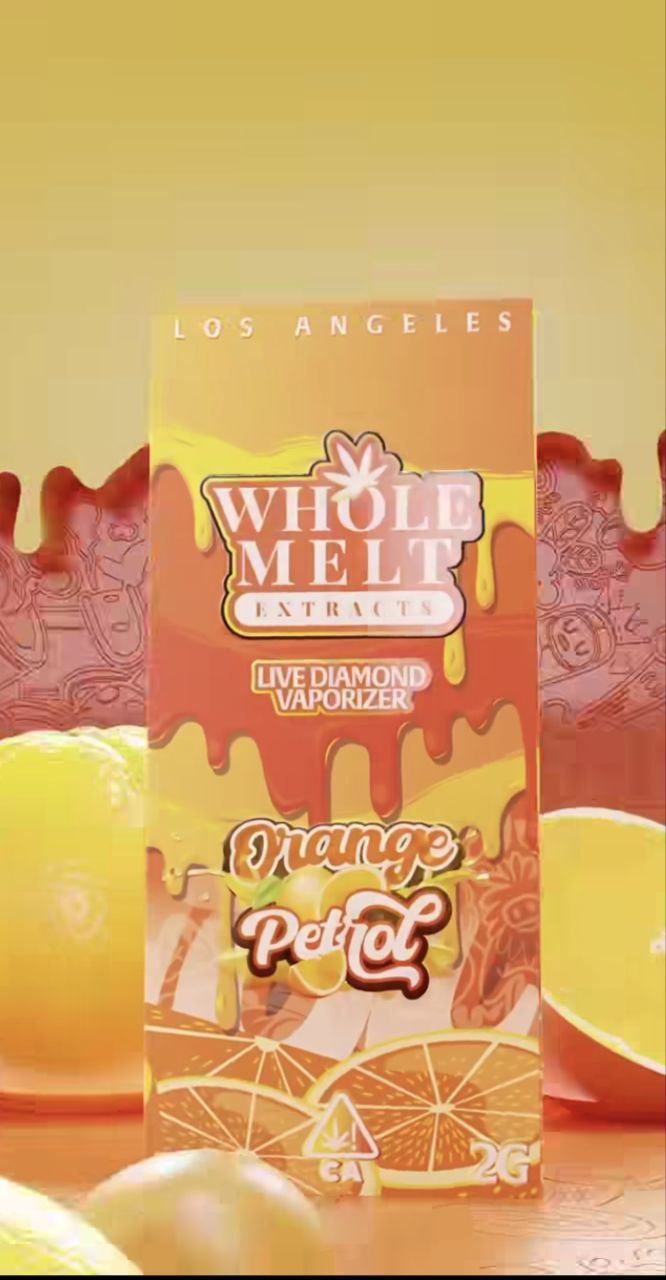 A vibrant packaging of "Import placeholder for 33" in Orange Petrol flavor is against a dripping orange and yellow background. The box displays cartoon oranges, with "Los Angeles" written at the top and "2G" at the bottom right.